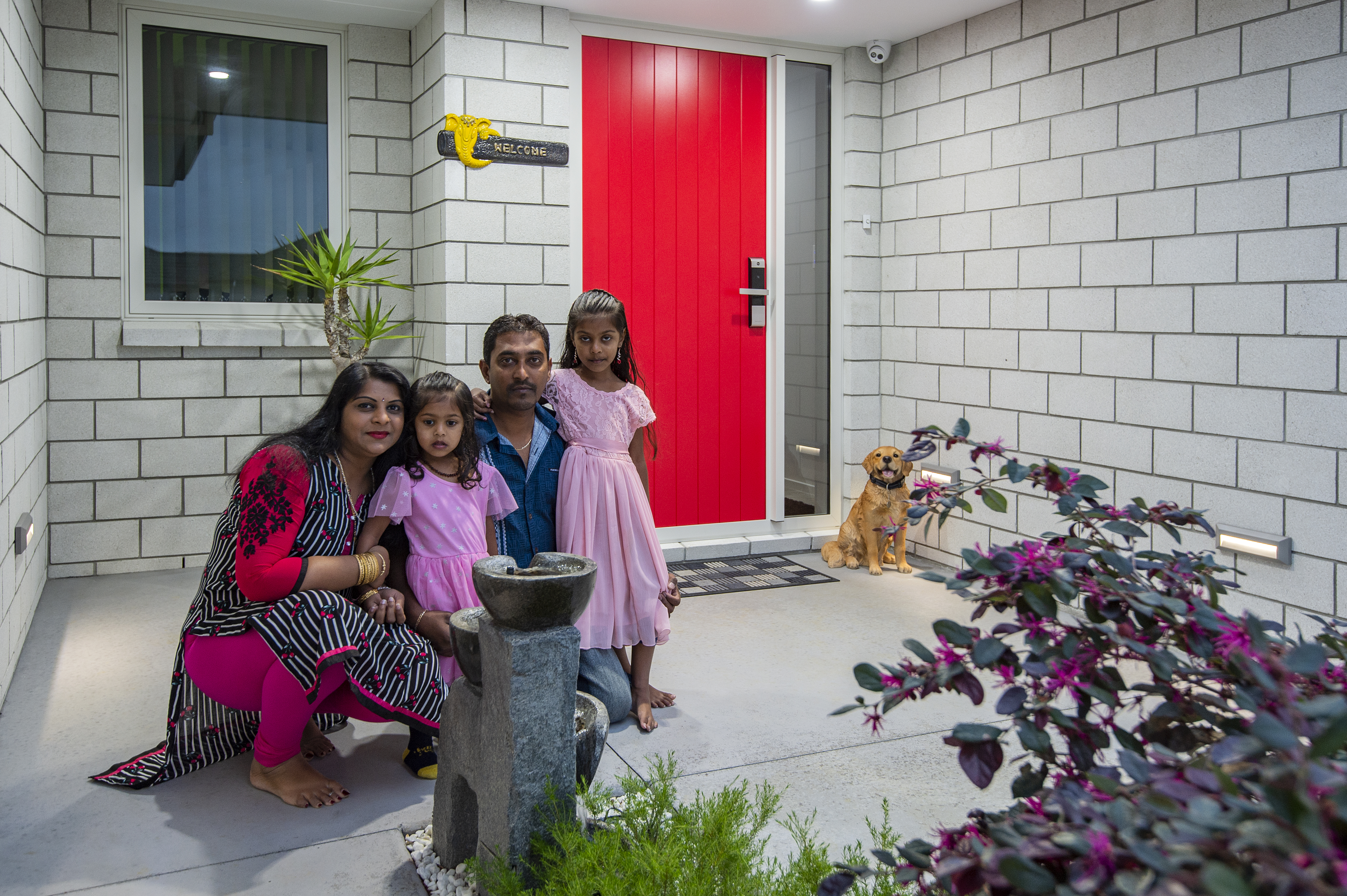 Classic Builders clients family photo in front of their new build home