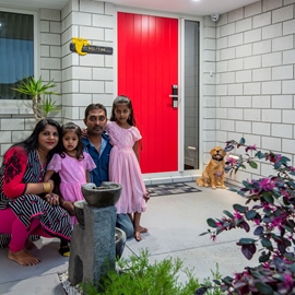 Classic Builders clients family photo in front of their new build home