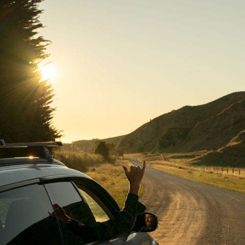 man driving from Hunua Views to the beach