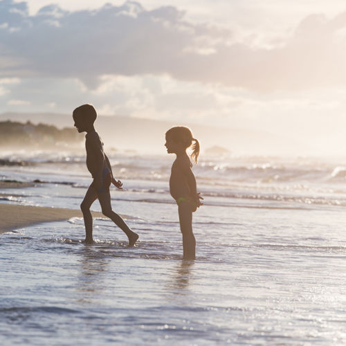 kids playing on beach Hunua Views